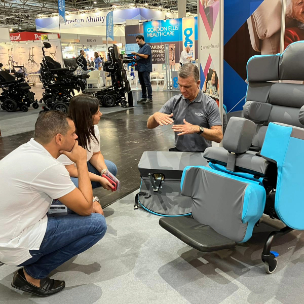 seating assessor demonstrating smartseat pro 2 at a trade show